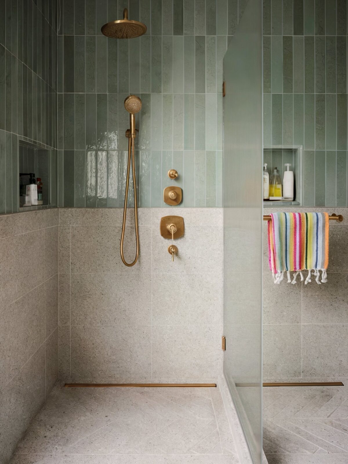 Coastal glam decor bathroom setting with muted green vertical tiles