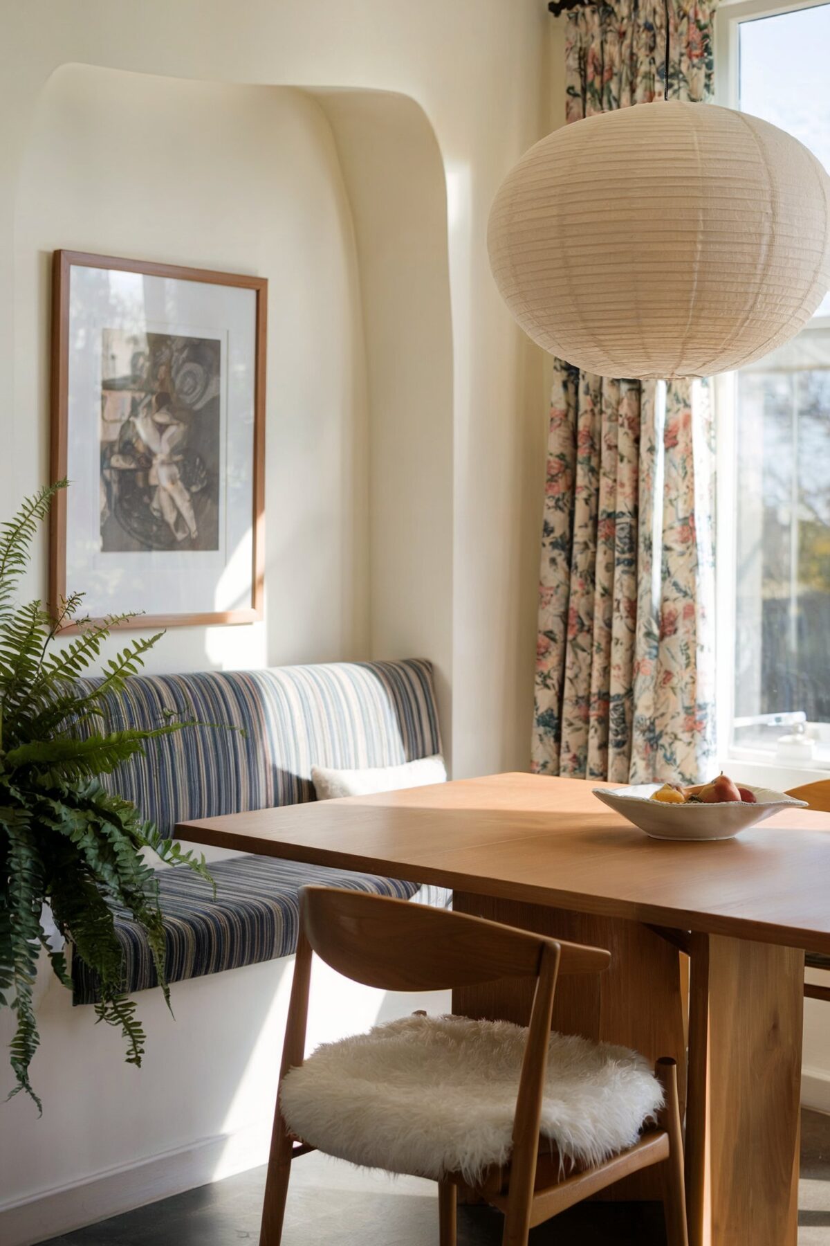 eclectic dining room banquette brown table window lighting