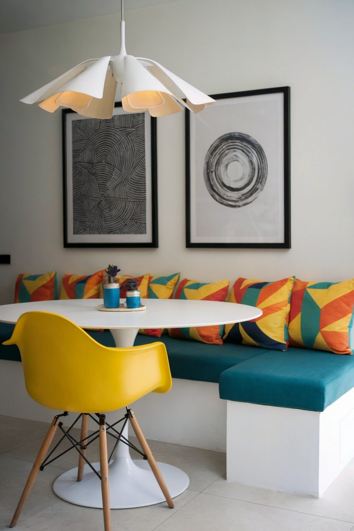 eclectic dining room banquette yellow chair blue banquette white table