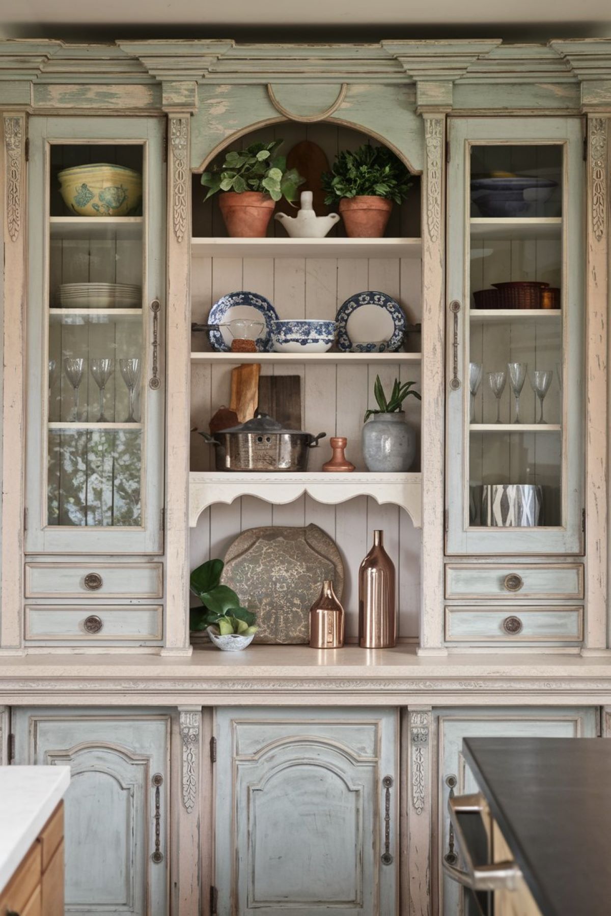 eclectic kitchen with a vintage hutch1