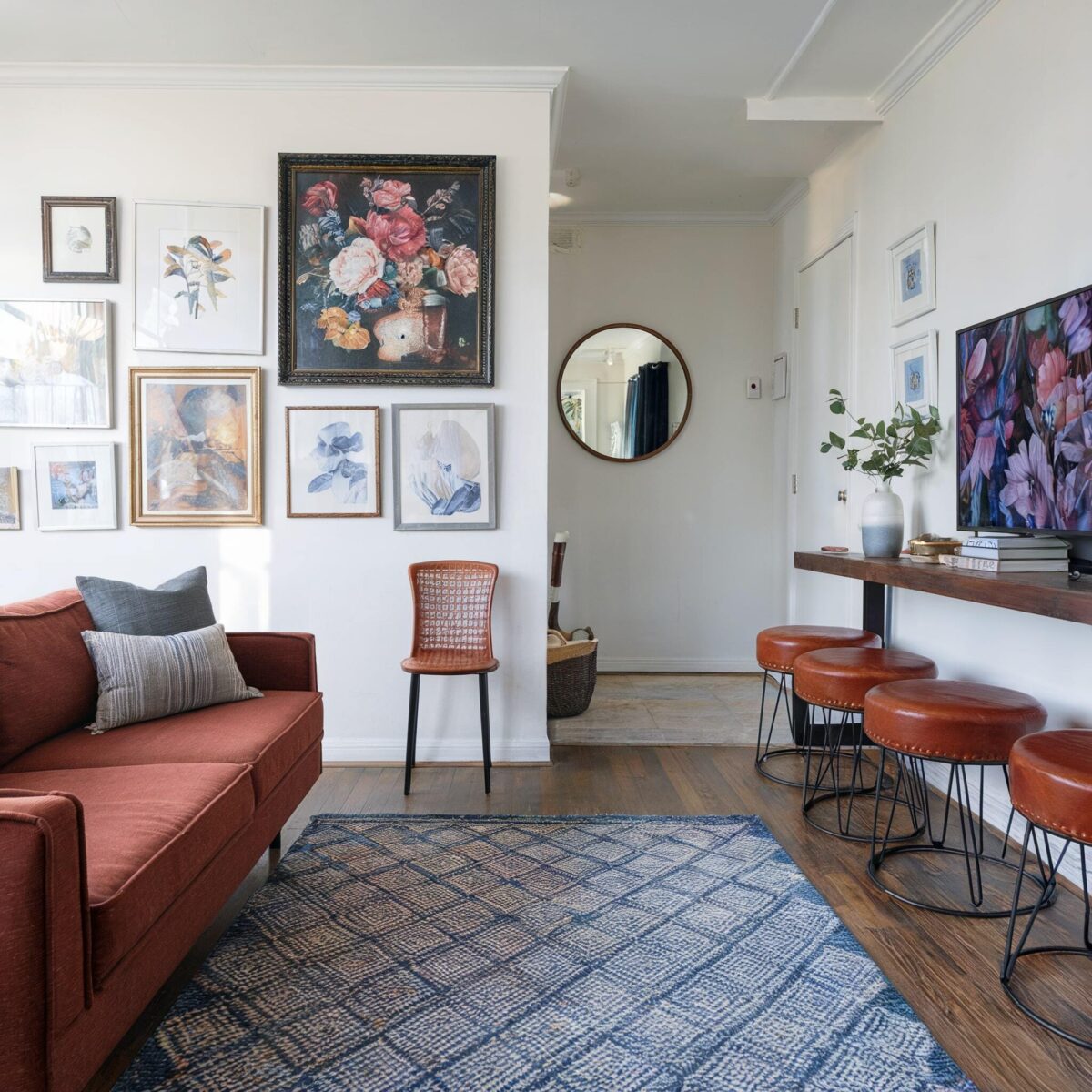 eclectic living room earthy rustic couch rustic chairs white walls