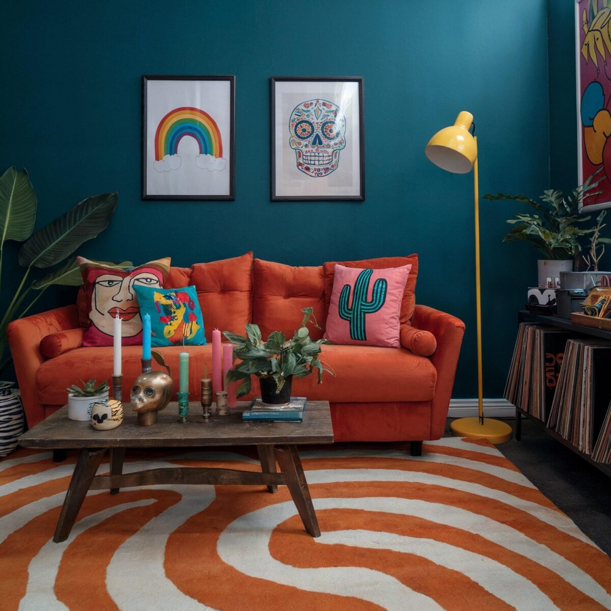 eclectic living room teal blue wall orange couch