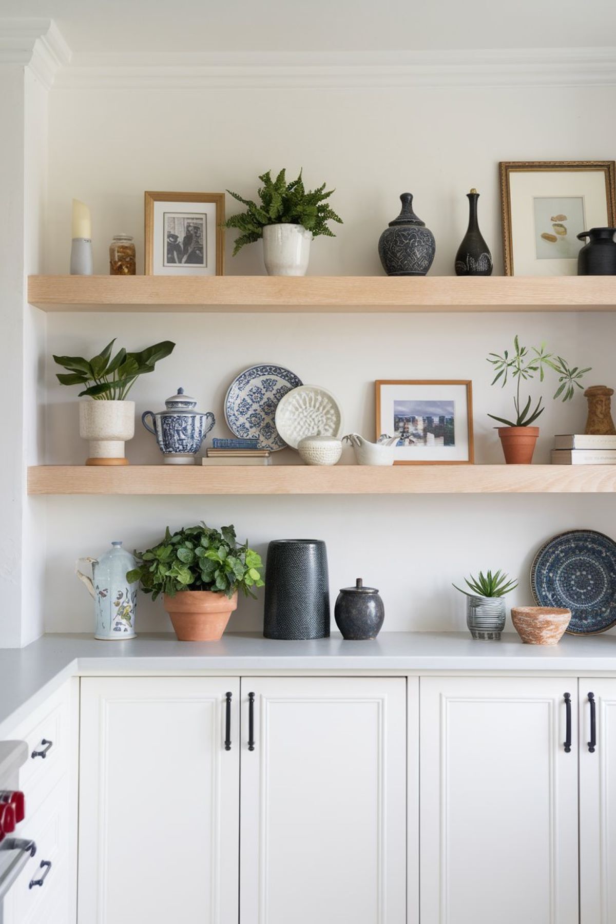 farmhouse kitchen with a neatly arranged shelf unit displaying a variety of decor items