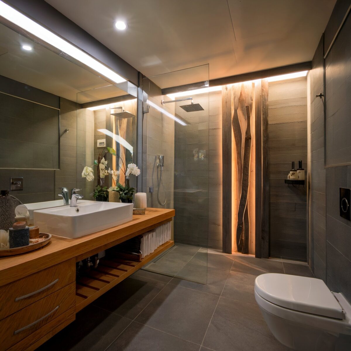 luxury dark tile bathroom ideas with a walk in shower area and unique wooden panel design