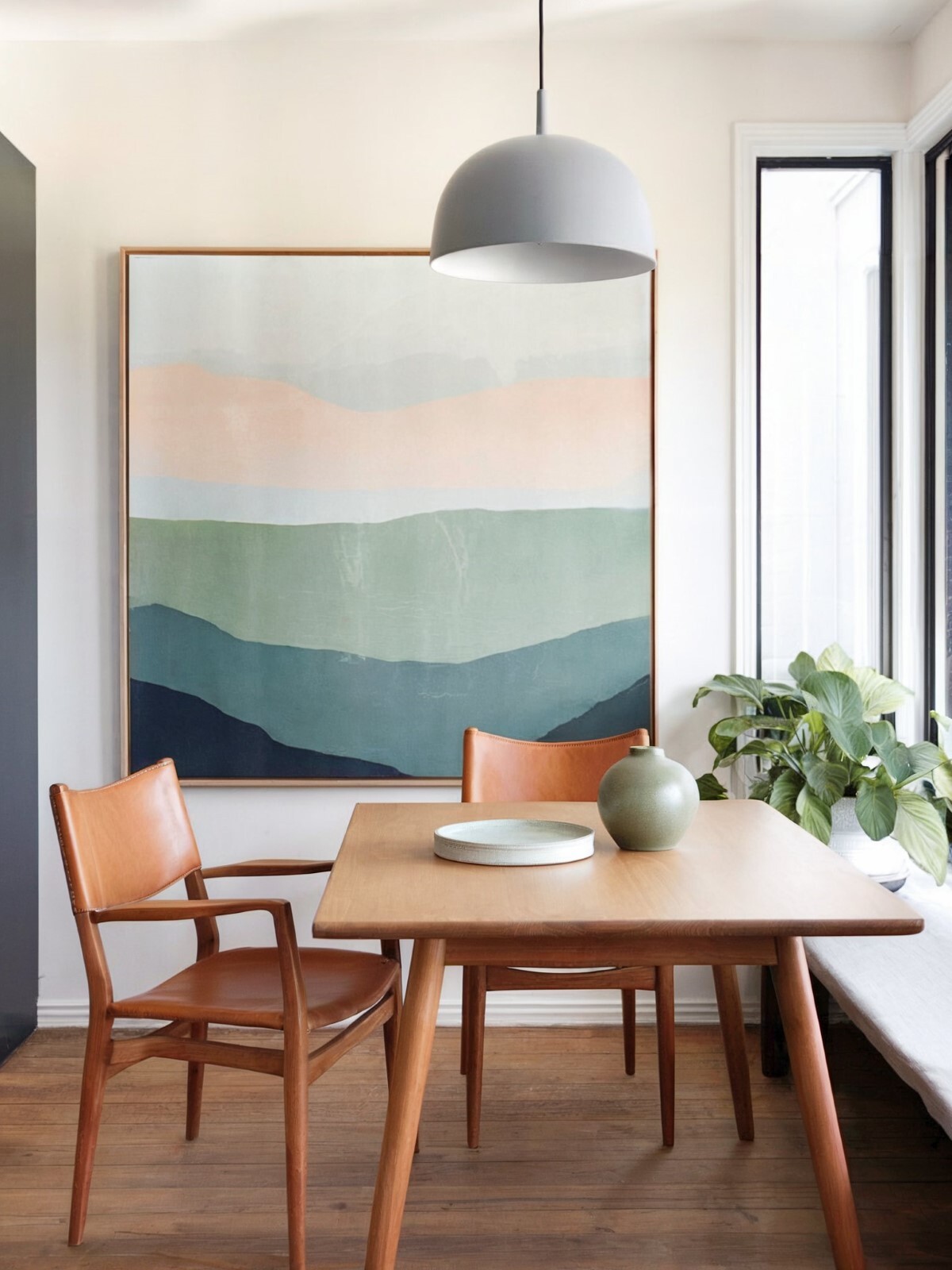 minimalist dining room wall art ideas dinning area with wooden chairs and dining table featuring a large framed artwork