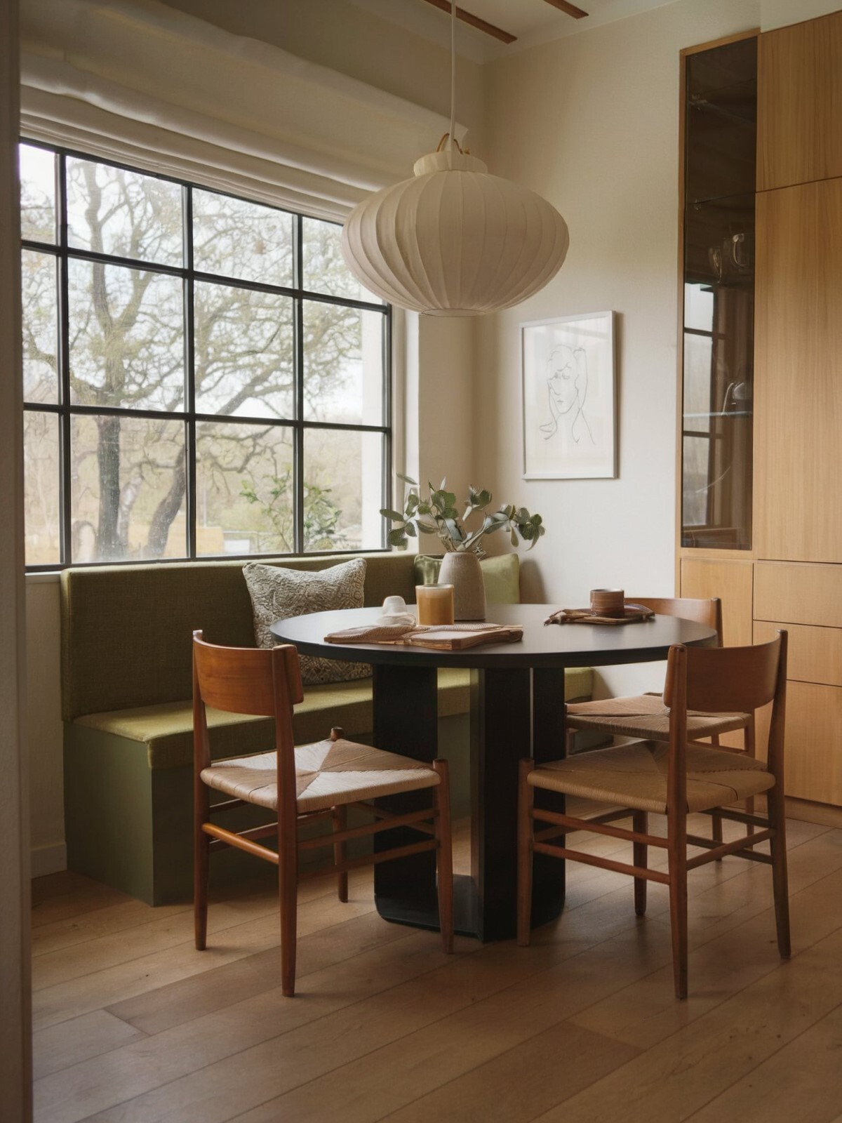 minimalist eclectic dining room decor elegantly designed dining area with round black table accompanied by two wooden chairs