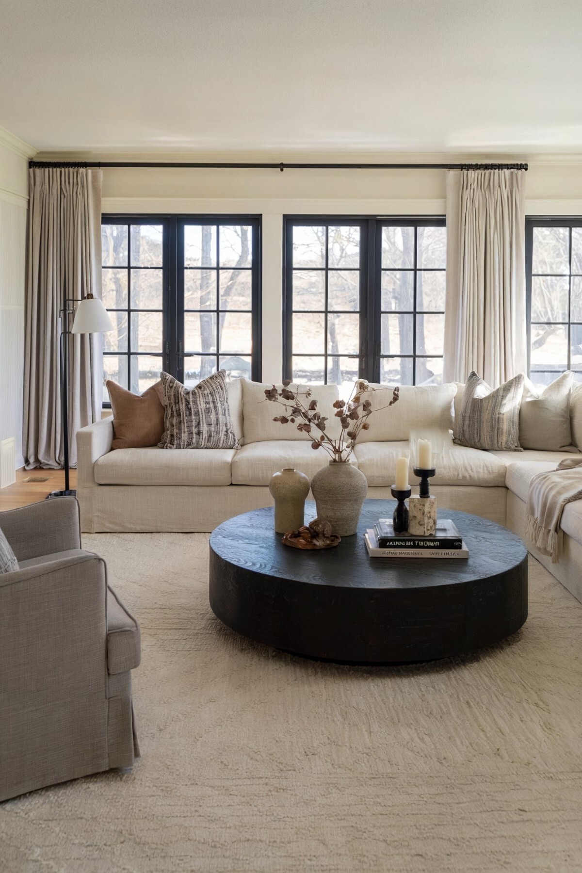 modern living room design small well lit living room, light colored rug floor and walls painted in soft white hue