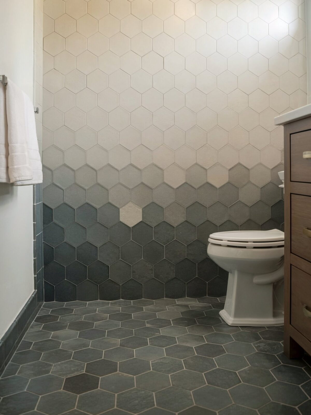 coastal hexagon bathroom tile The tiles transition from a light shade at the top to a deeper hue at the bottom, creating a gradient effect