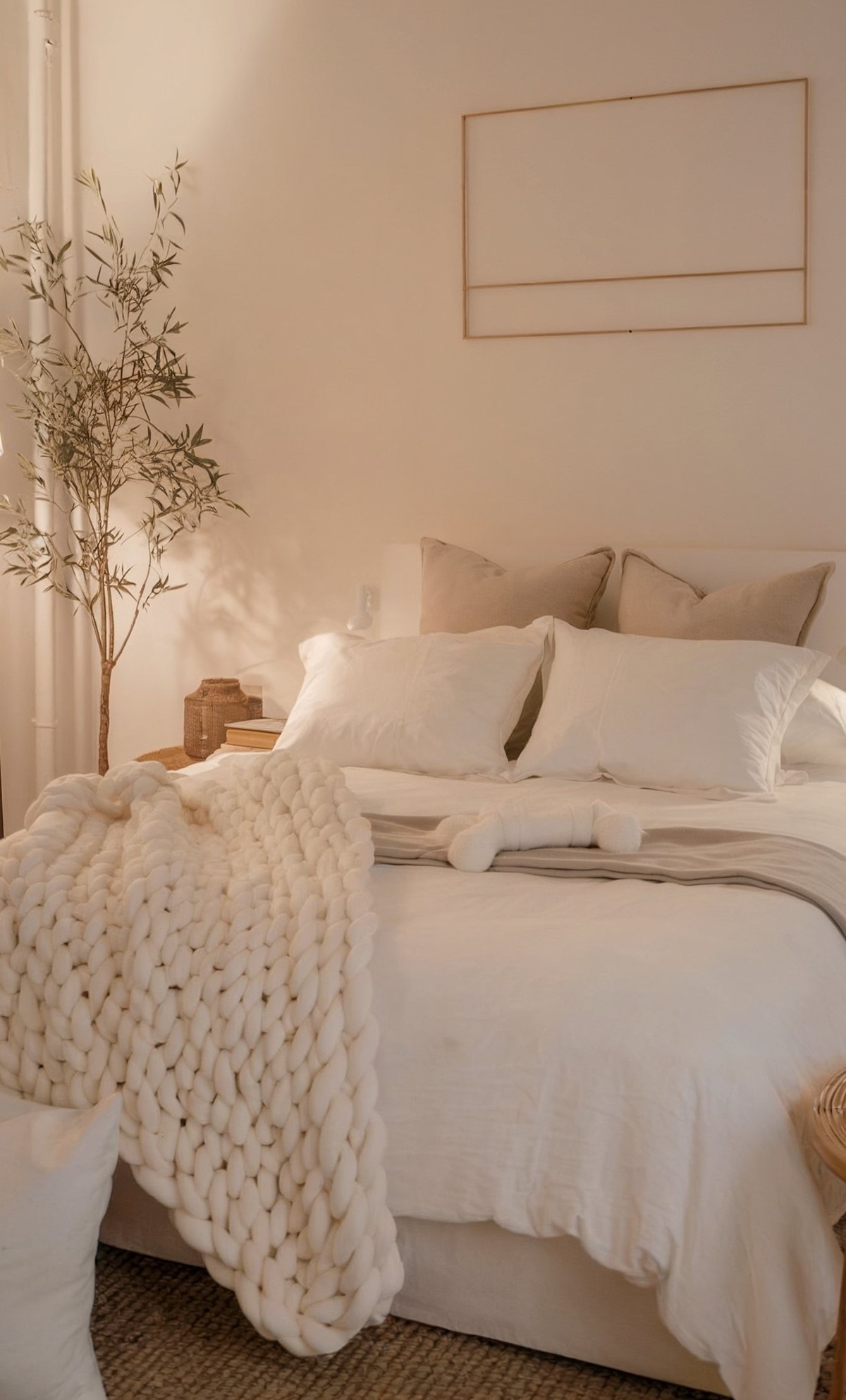 cozy small bedroom decor ideas interior design neatly made bed with white linens, positioned against a white wall