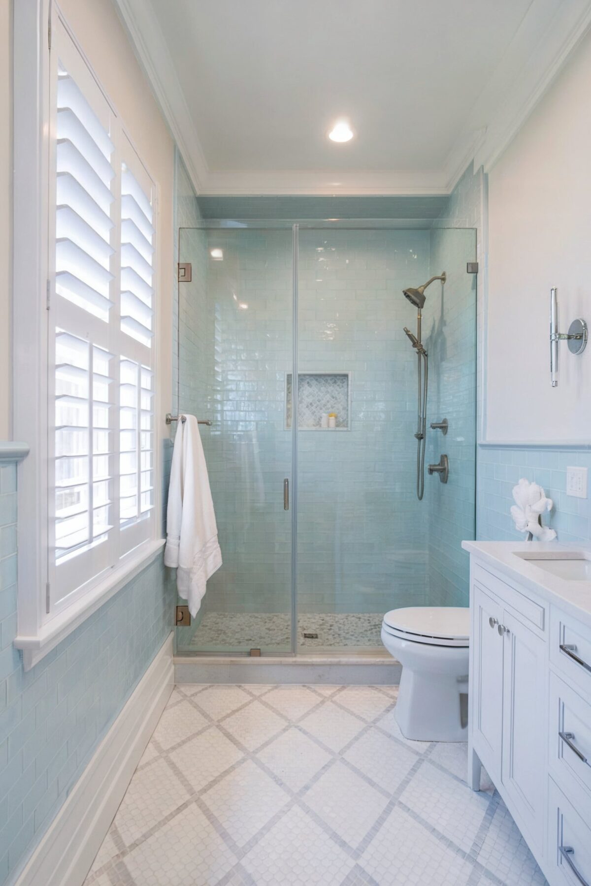 small bathroom shower tile ideas coastal with walls adorned with light blue subway tiles